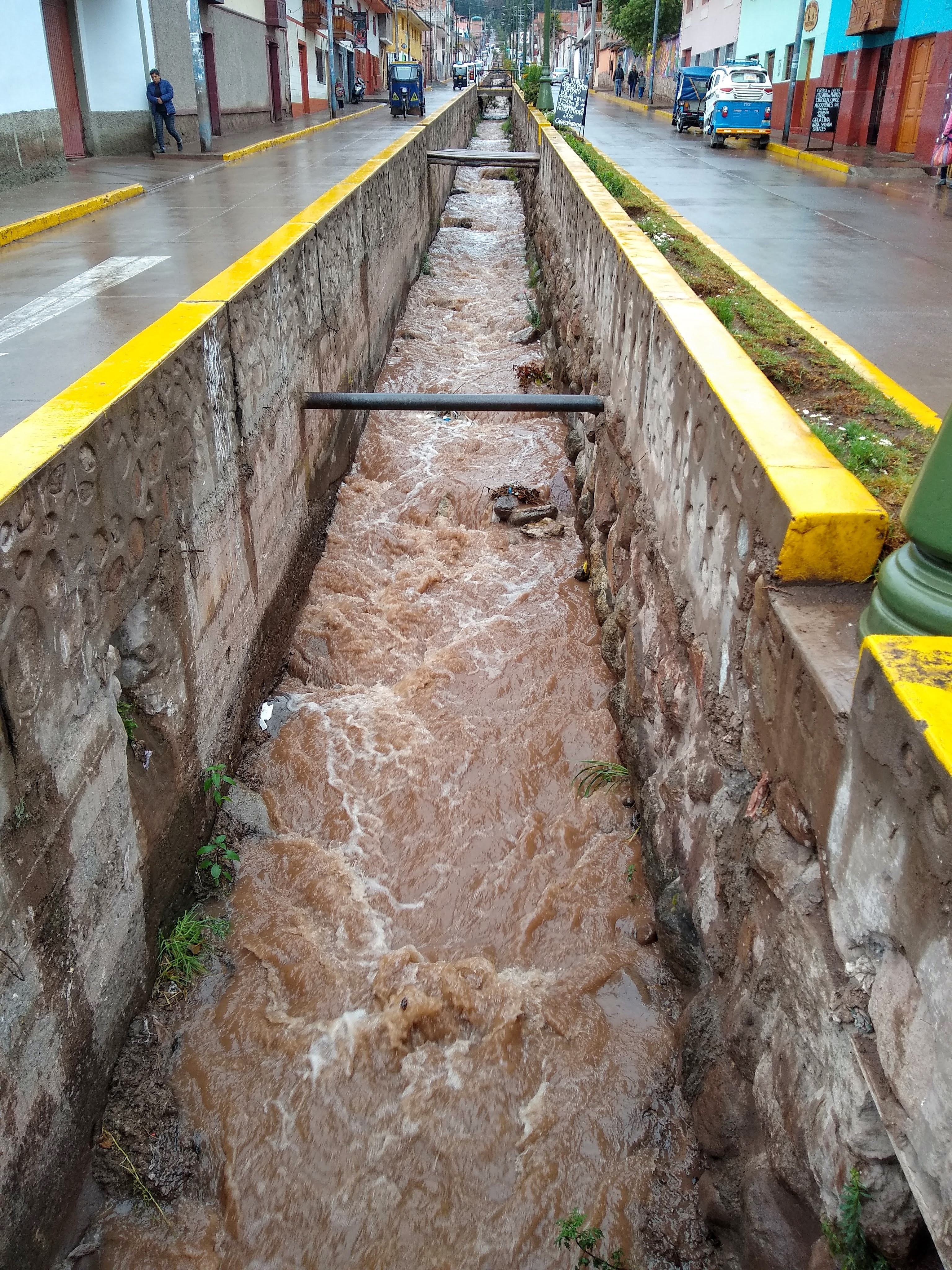 High volume of water flowing down the central drainage canal.
